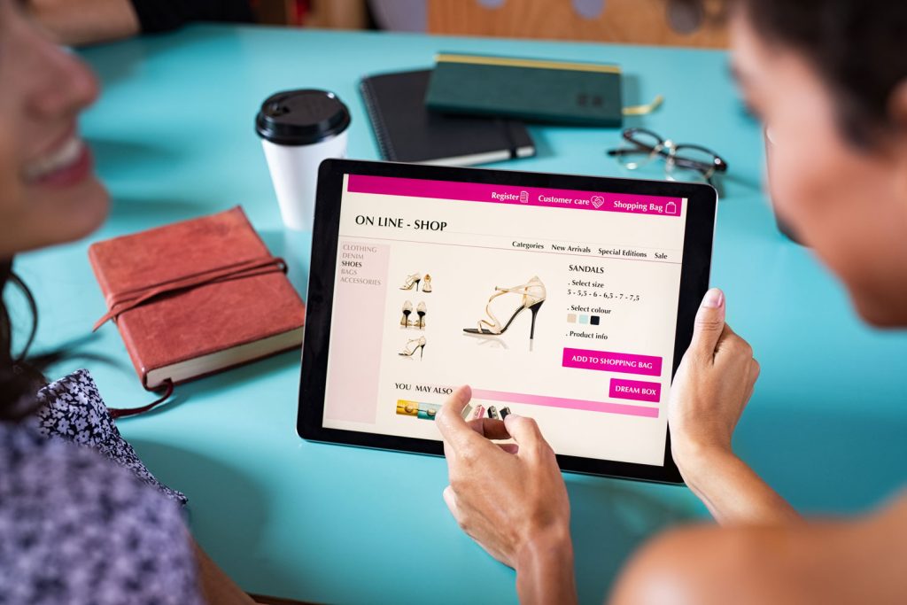 Women shopping on an ecommerce website for shoes